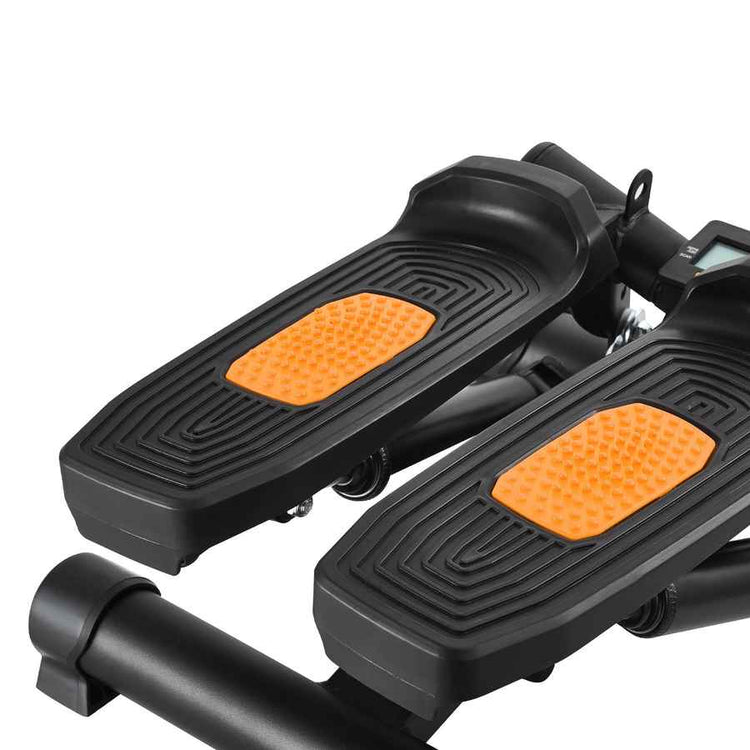 Black and orange exercise stepper on a white background
