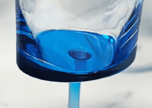 Bottom view of the LeadingWare unbreakable wine glass showing the vibrant blue acrylic base and seamless construction for durability.