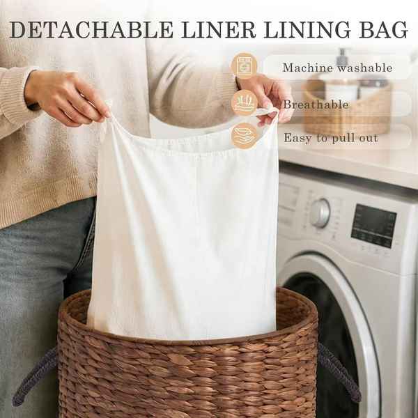 A person holds a white detachable fabric liner bag over a brown woven basket, with text overlays highlighting product features like machine washability and breathability. A washing machine is visible in the background.