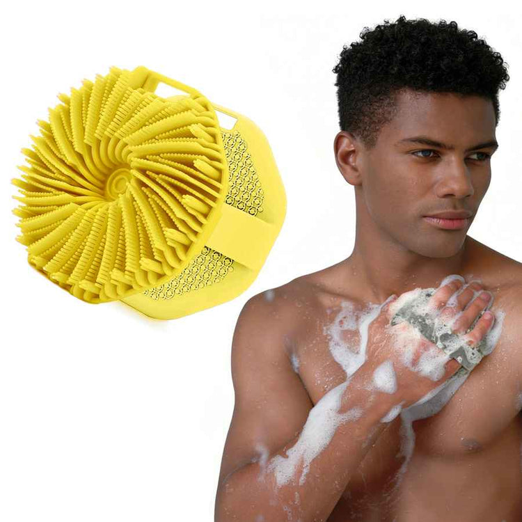 Man using a yellow exfoliating pad on his skin with a white background