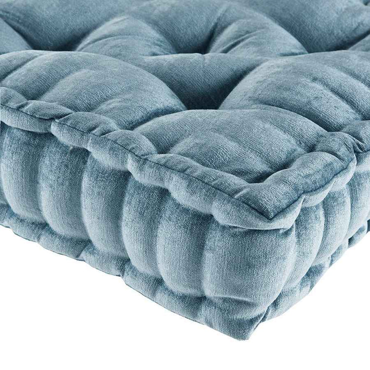 Blue textured cushion on a white background