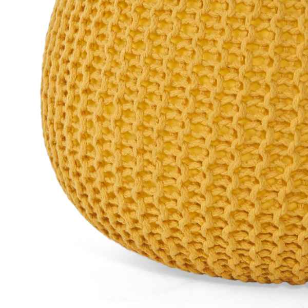 Close-up of a textured yellow cushion on a white background
