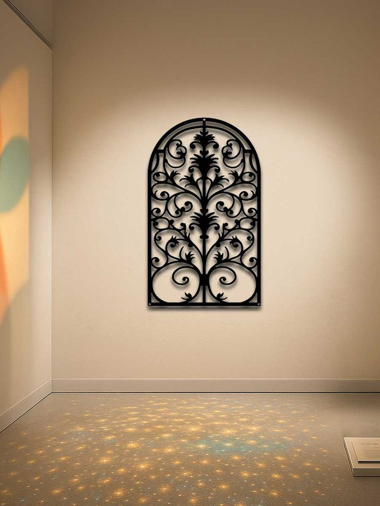 Decorative black wrought iron Gothic arch wall art in gallery setting