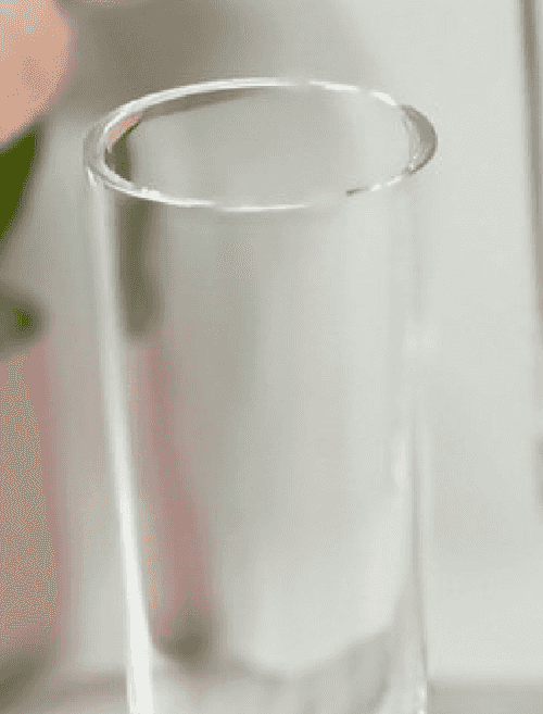 Close-up of the rim and upper portion of a blue acrylic unbreakable champagne flute, highlighting its smooth finish and durability.