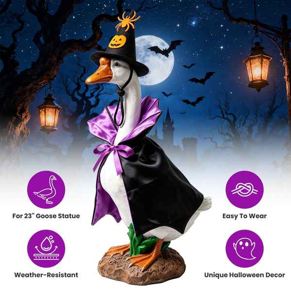 A Halloween decorative goose statue dressed as a witch, shown against a spooky night scene with trees, moon, bats, and lanterns. The goose wears a black witch hat with a pumpkin face, a black cape with a purple sash, and stands on a rocky base.
