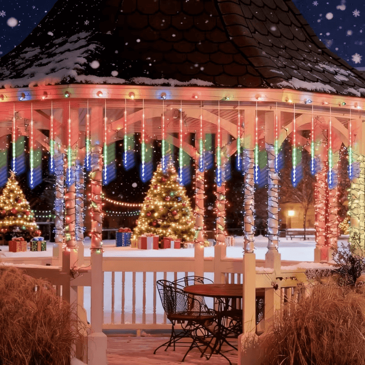 Gazebo decorated with meteor shower lights and a Christmas tree