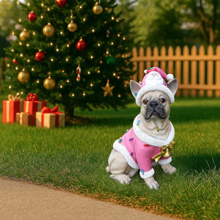 French Bulldog statue pink Santa on grass by a fence