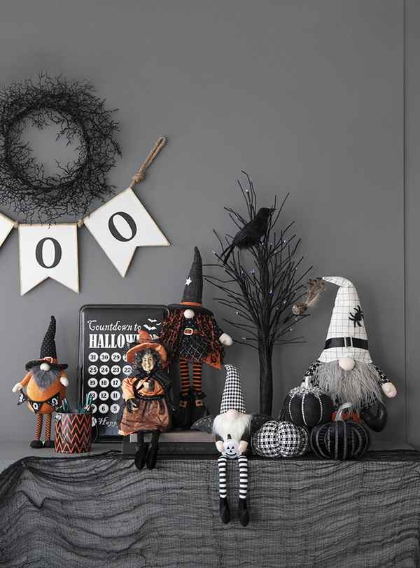 Halloween-themed decorations including gnomes, pumpkins, and a blackboard with &