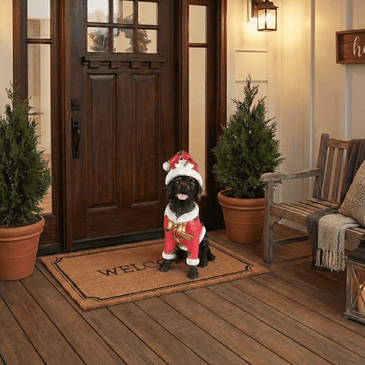 Christmas Labrador statue at a front door