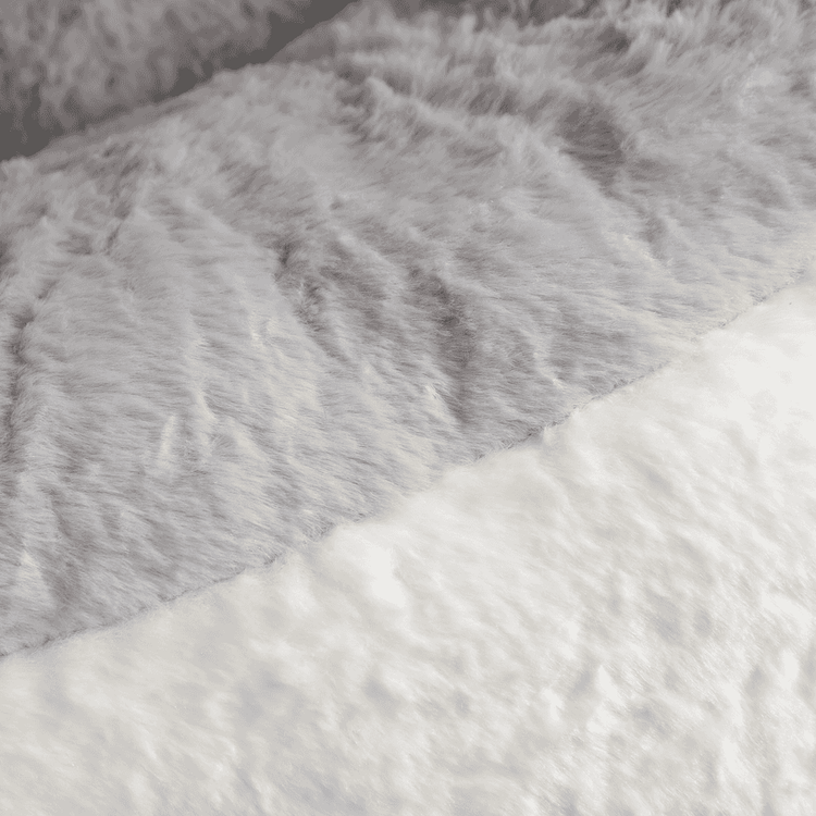 Close-up of gray and white fur fabric texture