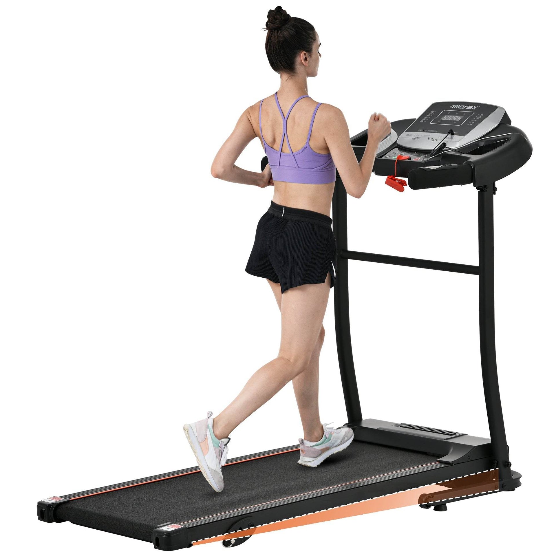 Woman running on black treadmill, indoor fitness equipment, workout activewear