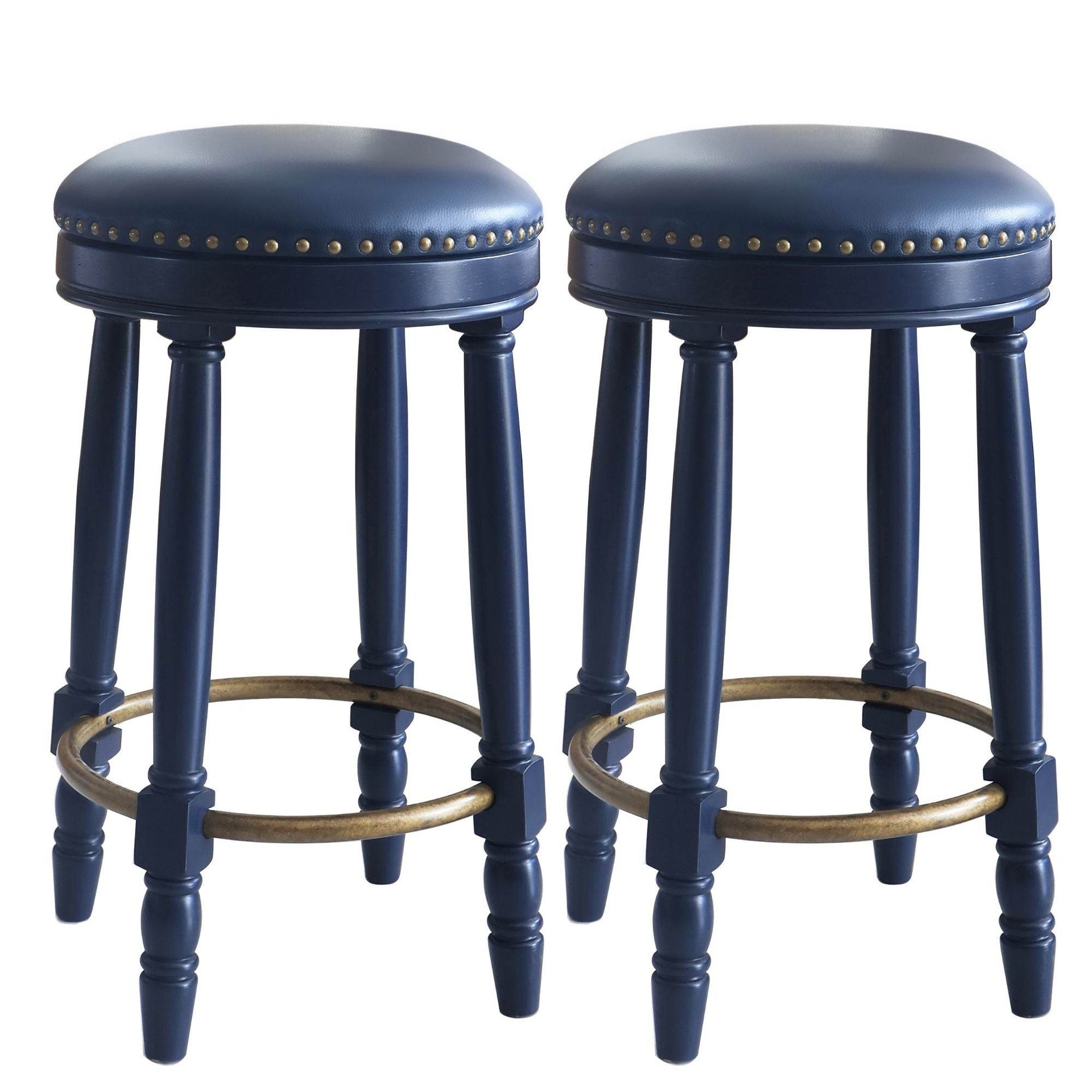 Pair of navy blue bar stools with gold nailhead trim and round footrests