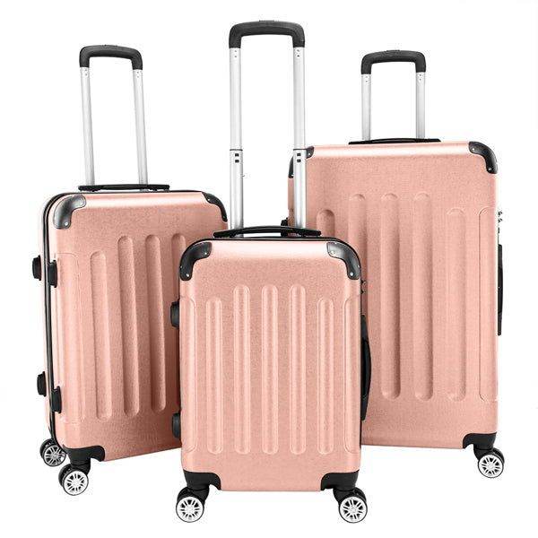 Set of three rose gold hard shell suitcases with wheels and telescopic handles
