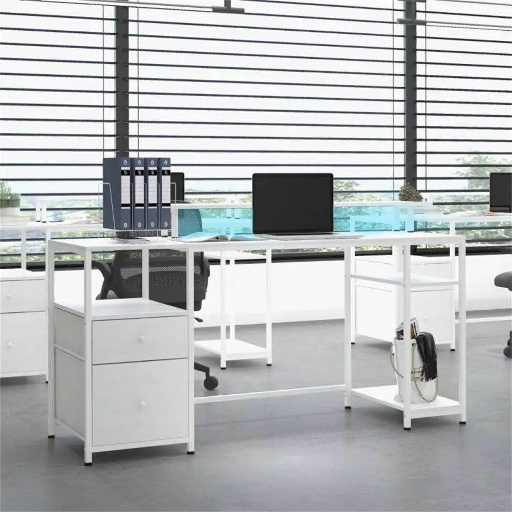 Modern white office desk with drawers, shelves, laptops, and binders in bright workspace