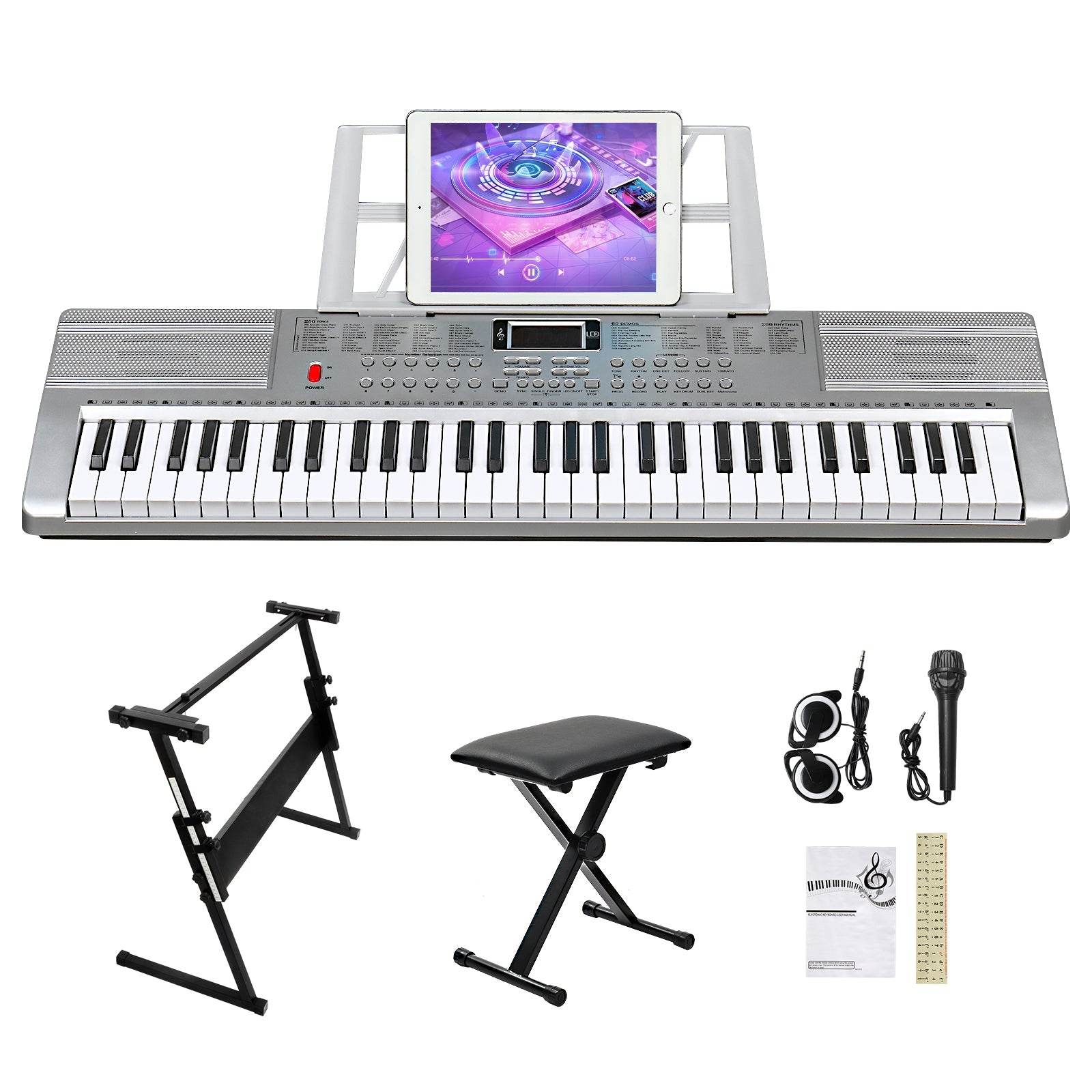 Digital keyboard piano set with tablet, stand, bench, headphones, microphone, and sheet music.