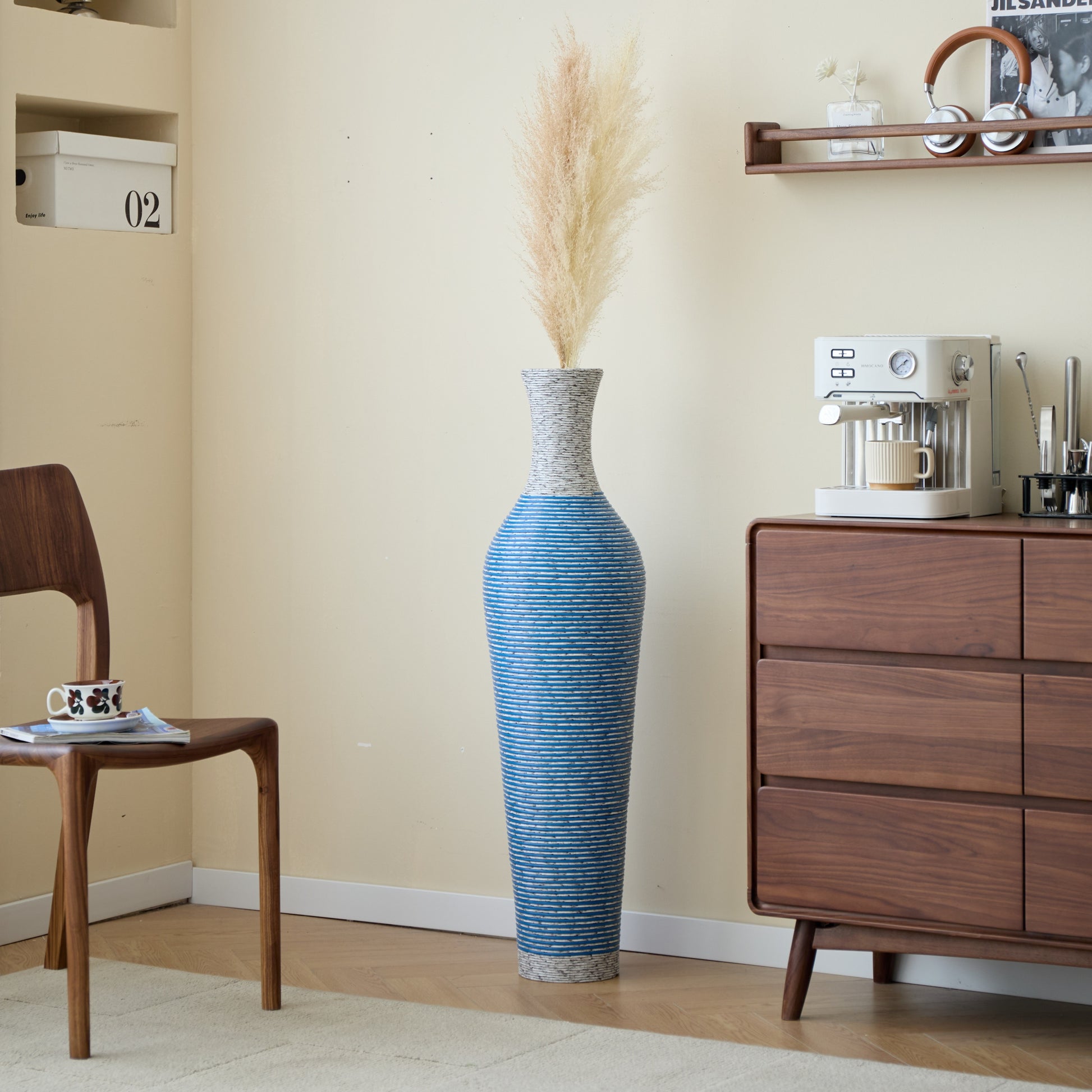 Tall 39-inch PVC floor vase decor in blue placed beside a wooden cabinet, perfect for adding vertical interest to interiors.