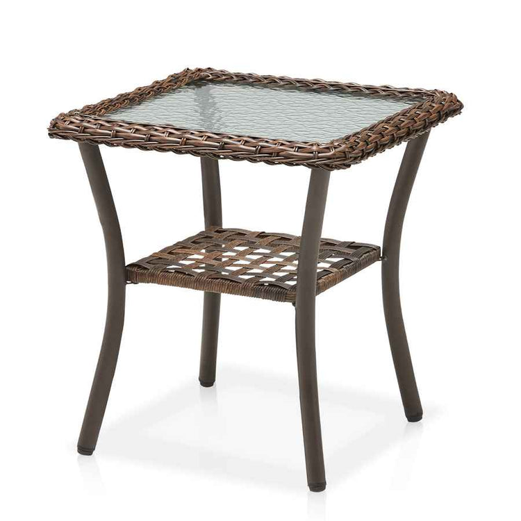Hexagonal outdoor side table with wicker top and glass surface on a white background
