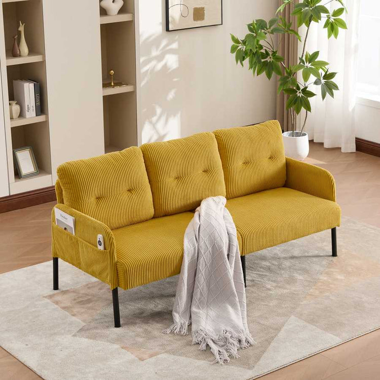 Yellow sofa with a white blanket in a living room setting
