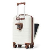 A cream-colored hardshell suitcase with brown trim, featuring an extended telescopic handle, four spinner wheels, a built-in bottle holder with a spring-loaded water bottle slot, and a partially unzipped side compartment.