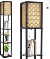 A tall black metal floor lamp with a woven beige shade and pull-chain switch, shown in two views on a white background. One view shows the lamp styled with books and a small plant on its shelves, and a light bulb icon appears in the top right corner.