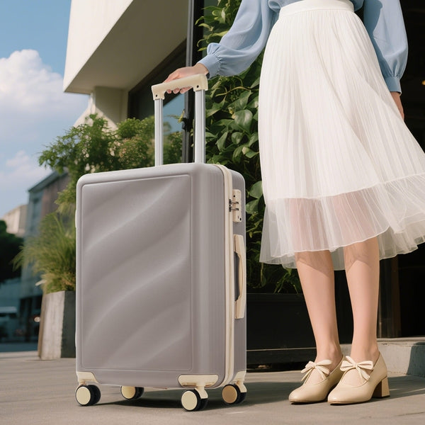 Stylish woman pulling a durable lightweight suitcase with TSA lock and spinner wheels, ideal for fashionable and secure travel.