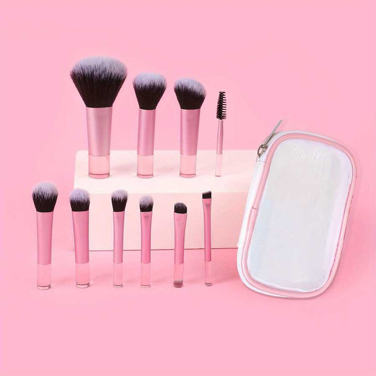 Compact 10-piece mini makeup brush set with pink handles and clear storage pouch. Includes face and eye brushes for versatile cosmetic use.