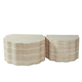 Top view of beige marble nesting coffee tables showing scalloped edges and smooth surface for modern living room setup