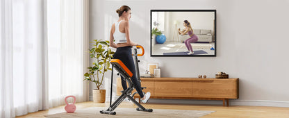 User exercising on Squat Machine Home while watching a virtual trainer, ideal for compact home fitness routines.