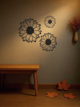 Elegant metal wall art for home decoration set of 3 sunflowers on a hallway wall with bench and autumn leaves. Adds seasonal rustic touch.