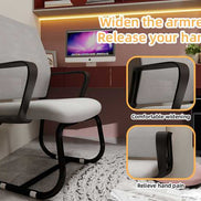 Office chair with armrest widening feature in a room setting