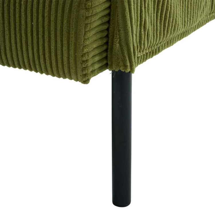 Close-up of a green textured chair with a black metal leg on a white background