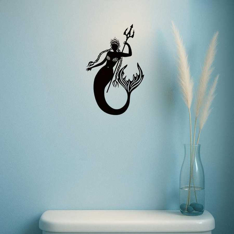 Mermaid Sea King Iron Relief Art on light blue wall above shelf with vase, a handcrafted sculpture for beach-style interiors.