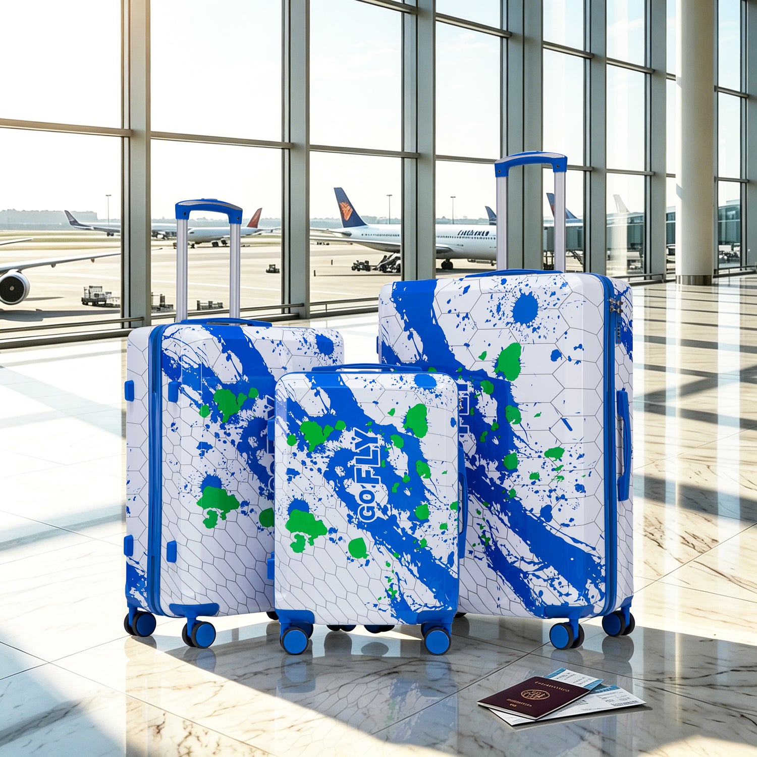 Three suitcases with blue and green abstract design in an airport setting