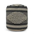 Textured cylindrical pouf with black and gray stripes on a white background