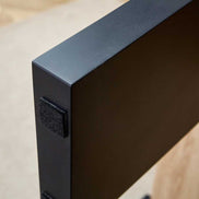 Close-up of black leg base with protective pad on MDF Coffee Table, designed to prevent floor scratches and enhance stability.