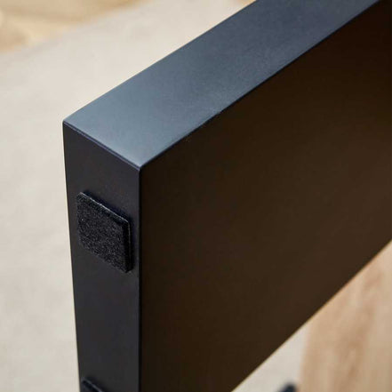 Close-up of black leg base with protective pad on MDF Coffee Table, designed to prevent floor scratches and enhance stability.
