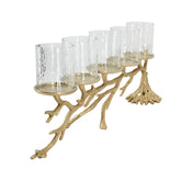 A five-light candle holder with a branch-like gold metal base and clear glass candle sleeves, shown on a plain white background.