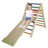 Child on a colorful wooden slide and climbing structure