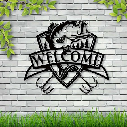 Black fish wall decor with trees and 'Welcome' banner on white siding