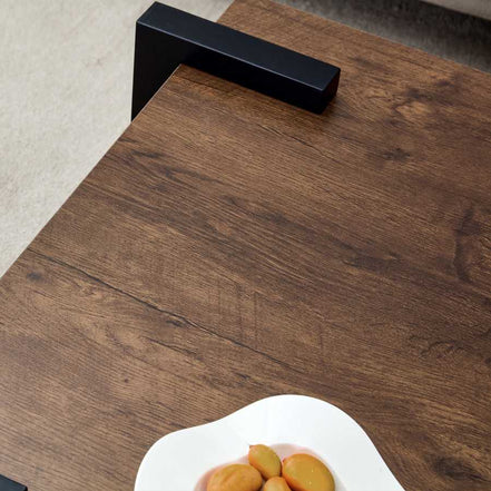 Close-up of walnut MDF tabletop on Modern Minimalist Coffee Table, showing realistic wood grain texture and smooth surface.