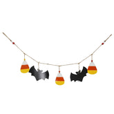 Halloween-themed decorative garland with candy corn and bats on a white background