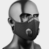 Black face mask with filter pocket on a mannequin head against a gray background