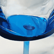 Bottom view of the LeadingWare unbreakable wine glass showing the vibrant blue acrylic base and seamless construction for durability.
