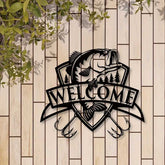 Black fish wall decor with trees and &