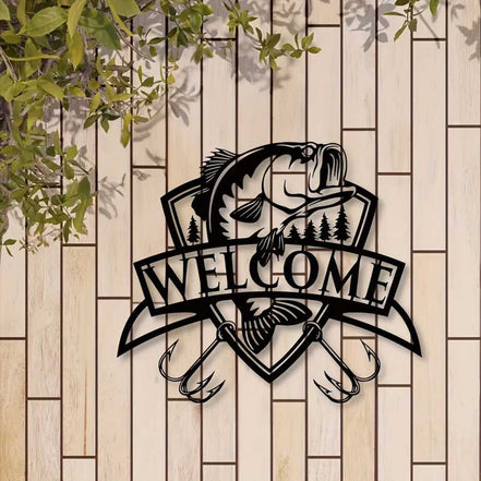 Black fish wall decor with trees and 'Welcome' banner on white brick wall