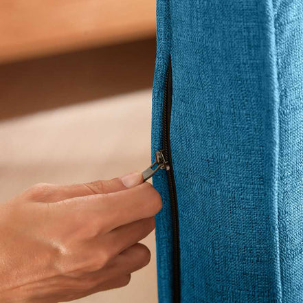 Detail of zipper on the Convertible Folding Chair Bed - Compact & Multi-Functional, showing removable blue linen cover for easy cleaning.