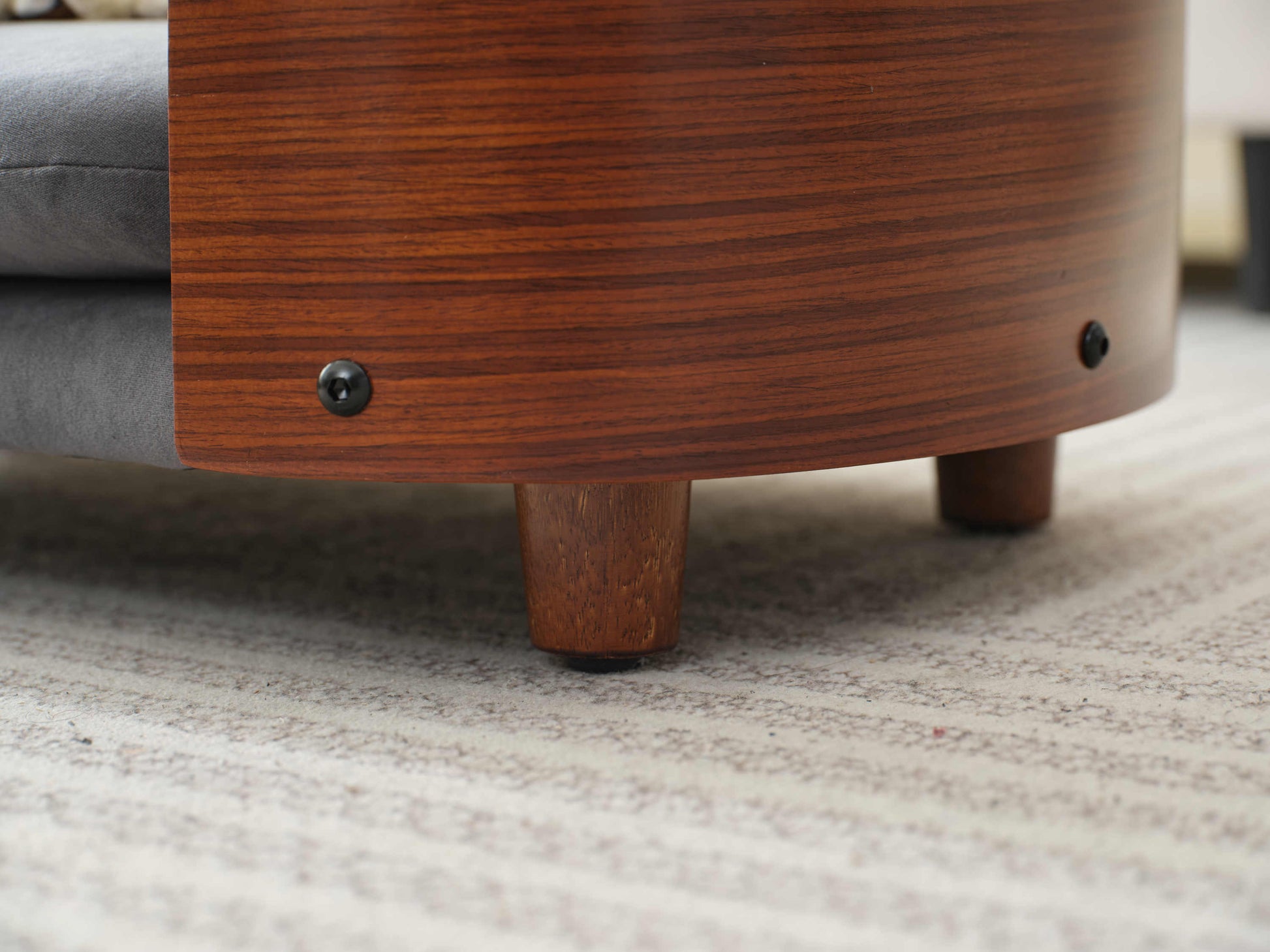 Close-up of solid wood leg and curved frame detailing on Scandinavian Elevated Dog Bed, showcasing premium craftsmanship.