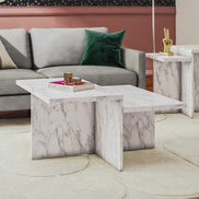 Brielle Faux Marble Coffee Table styled with books and decor, highlighting its dual-tier surface and durable marble-look finish.