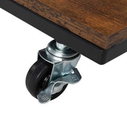 Detail of caster wheel on black metal frame of salon cart