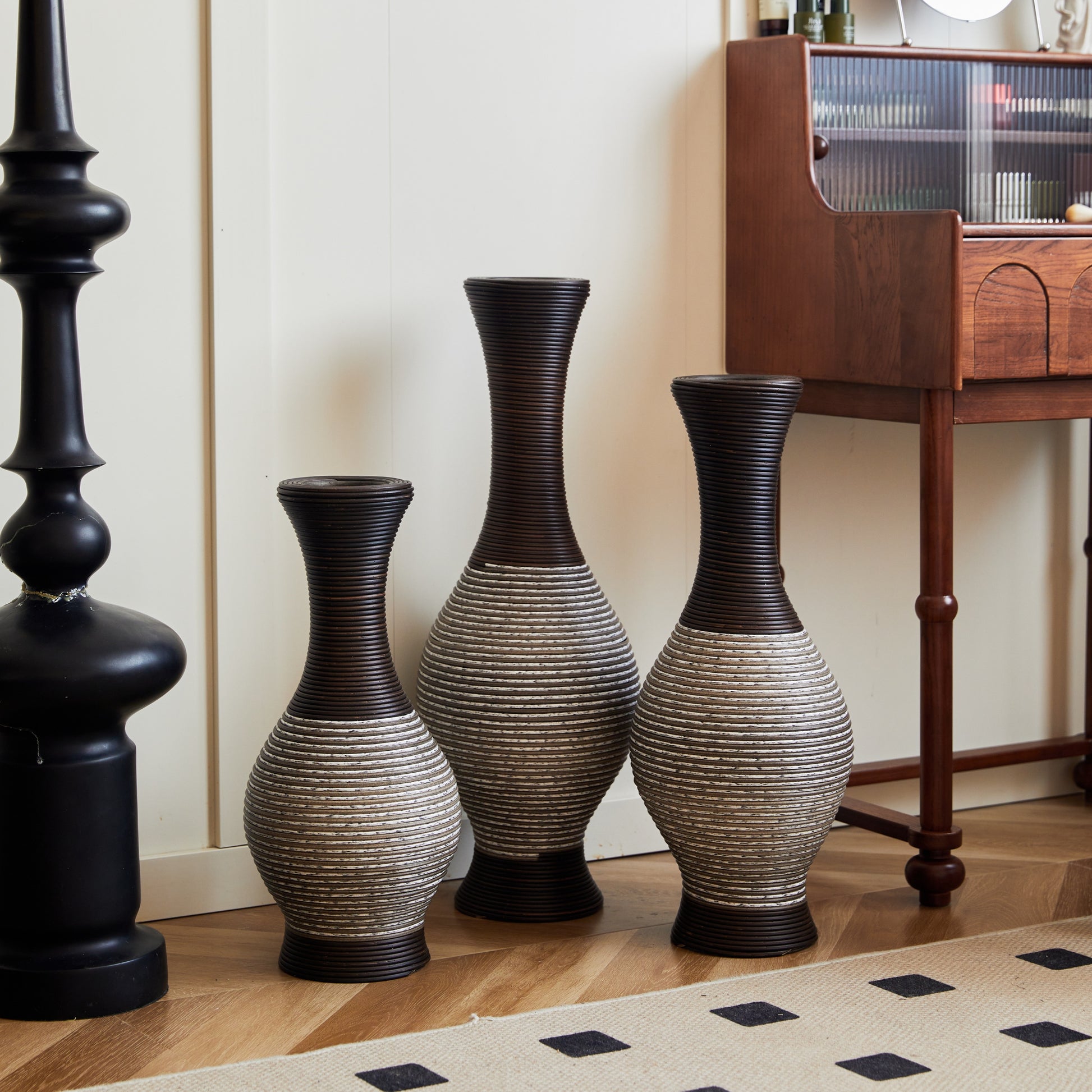 Modern brown floor vase set of 3 with tall, curved design, perfect for home décor, shown near a black lamp and wooden writing desk.